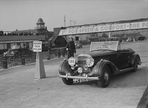 Bentley 4-seater tourer of GG Wood competing in the JCC Rally, Brooklands, Surrey, 1939. Artist: Bill Brunell.