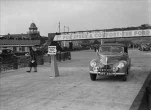 Ford V8 drophead competing in the JCC Rally, Brooklands, Surrey, 1939. Artist: Bill Brunell.