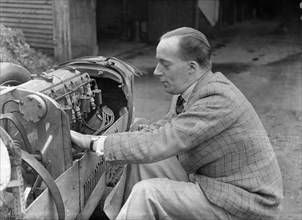 Charles Mortimer working on the engine of a MG KN Special, c1930s Artist: Bill Brunell.