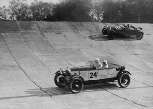 Lagonda and Alfa Romeo on the banking at the JCC Double Twelve Race, Brooklands, Surrey, 1929. Artist: Bill Brunell.