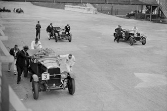 Studebaker and two OMs at the JCC Double Twelve Race, Brooklands, Surrey, 1929. Artist: Bill Brunell.
