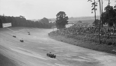 Austin 7 of Charles Goodacre and MG C of the Earl of March, BRDC 500 Mile Race, Brooklands, 1931. Artist: Bill Brunell.