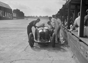 Amilcar C6 of Bill Humphreys in the pits, BRDC 500 Mile Race, Brooklands, 1931. Artist: Bill Brunell.