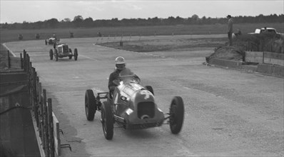 MG racing at Brooklands, Surrey, c1930s. Artist: Bill Brunell.