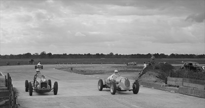 Two MGs racing at Brooklands, Surrey, c1930s. Artist: Bill Brunell.