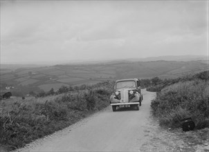 Vauxhall saloon of KFA Walker competing in the MCC Torquay Rally, 1938. Artist: Bill Brunell.