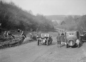 Riley open 4-seater tourer at the JCC Half-Day Trial, Ranmore Common, Dorking, Surrey, 1930. Artist: Bill Brunell.