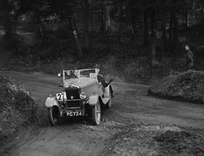 Standard Nine open 2-seater competing in the JCC Half-Day Trial, 1930. Artist: Bill Brunell.