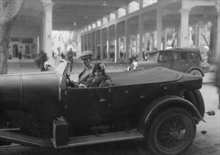 Lord de Clifford and Kitty Brunell in a Lagonda, San Remo, Italy, c1930(?). Artist: Bill Brunell.