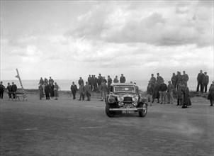 Alvis Speed Twenty saloon competing in the RSAC Scottish Rally, 1934. Artist: Bill Brunell.