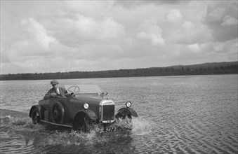 HG Pope driving a GWK through water at a demonstration event, Frensham Common Pond, Surrey, 1922. Artist: Bill Brunell.
