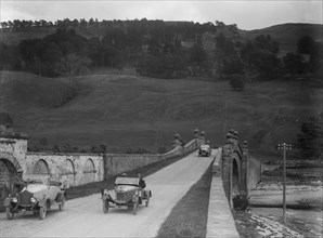 Lagonda of WH Oates, Calcott open tourer and Wolseley at the Scottish Light Car Trial, 1922. Artist: Bill Brunell.