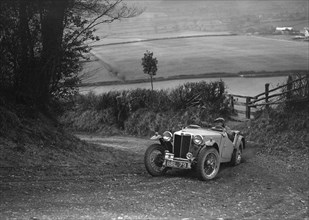 MG TA of Ken Crawford of the Cream Cracker Team at the MG Car Club Midland Centre Trial, 1938. Artist: Bill Brunell.