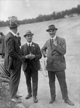 John Portwine and Selwyn Edge of AC Cars at Brooklands motor racing circuit, Surrey, c1921. Artist: Bill Brunell.