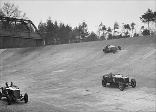 Bentley of Major H Butler and Sunbeam of BO Davis racing at a BARC meeting, Brooklands, 1930. Artist: Bill Brunell.