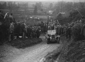 Alvis of RC Porter competing in the MCC Exeter Trial, Ibberton Hill, Dorset, 1930. Artist: Bill Brunell.