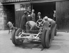 Working on Raymond Mays' Vauxhall-Villiers, c1930s. Artist: Bill Brunell.