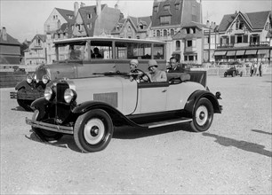 Opel open 2-seater and Laffly omnibus, Boulogne Motor Week, France, 1928. Artist: Bill Brunell.