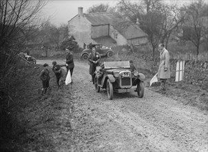 Austin Ulster of WGE Rushworth competing in the NWLMC London-Gloucester Trial, 1931. Artist: Bill Brunell.