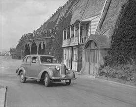 Vauxhall 14-6 of GL Boughton competing in the RAC Rally, Madeira Drive, Brighton, 1939. Artist: Bill Brunell.