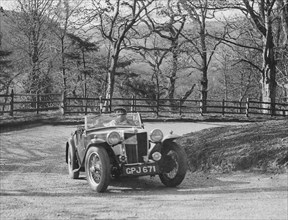 MG TA of FW Ellis competing in the RAC Rally, 1939. Artist: Bill Brunell.