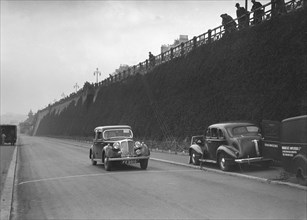 Rover saloon of A Corrie competing in the RAC Rally, Madeira Drive, Brighton, 1939. Artist: Bill Brunell.