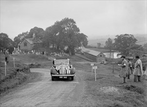Jaguar SS saloon of SG Davies competing in the South Wales Auto Club Welsh Rally, 1937 Artist: Bill Brunell.