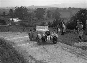 Ford V8 of TC Wise competing in the South Wales Auto Club Welsh Rally, 1937 Artist: Bill Brunell.