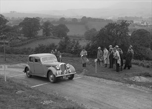 Rover saloon of WJH Davies competing in the South Wales Auto Club Welsh Rally, 1937 Artist: Bill Brunell.