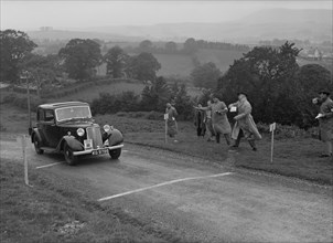 Armstrong-Siddeley of HK Roberts competing in the South Wales Auto Club Welsh Rally, 1937 Artist: Bill Brunell.