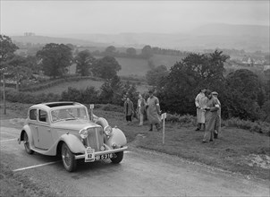 Jaguar SS saloon of N Howfield competing in the South Wales Auto Club Welsh Rally, 1937 Artist: Bill Brunell.