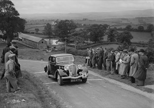 Triumph saloon of KN Smith competing in the South Wales Auto Club Welsh Rally, 1937 Artist: Bill Brunell.