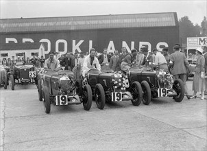 Three MG Magnas at the LCC Relay Grand Prix, Brooklands, Surrey, 1933. Artist: Bill Brunell.