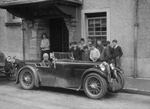 Kitty Brunell in her MG Magna outside the Stag Hotel, Edinburgh, RSAC Scottish Rally, 1932. Artist: Bill Brunell.