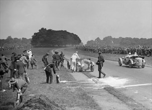 Recovering George Eyston's fire-damaged Bugatti T43, Irish Grand Prix, Phoenix Park Dublin, 1929. Artist: Bill Brunell.