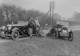 AC 4-seater tourer of Kitty Brunell and a Wolseley Hornet at the RAC Rally, 1933. Artist: Bill Brunell.