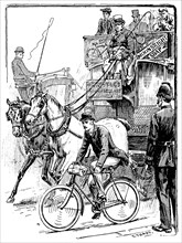 Cyclist in busy London traffic riding a machine of the Rover safety type, 1895. Artist: Stephen T Dadd