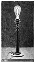 Edison's incandescent light globe in a table lamp fitting, 1891. Artist: Unknown