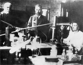 Pierre and Marie Curie, French scientists, at work in the laboratory. Artist: Unknown