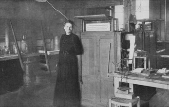 Marie Curie, Polish-born French physicist, in her laboratory, 1912. Artist: Unknown