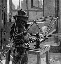 Sandblasting the joints of a bicycle frame, France, 1896. Artist: Unknown