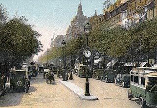 Boulevard des Italiens, Paris, with cars and motor buses on the street, c1900. Artist: Unknown