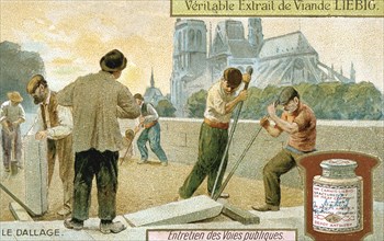 Laying paving slabs in a Paris street, c1900. Artist: Unknown
