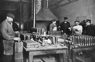 Filling shrapnel shells in a British munitions factory, World War I, 1914-1918. Artist: Unknown