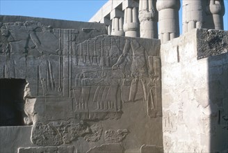Relief of the Pharaoh smiting his enemies, Temple sacred to Amun, Mut and Khons, Luxor, Egypt. Artist: Unknown