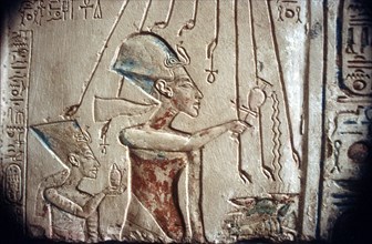 Relief of Akhenaten and Nefertiti under the rays of the sun-god Aten, Egyptian Museum:Cairo. Artist: Unknown