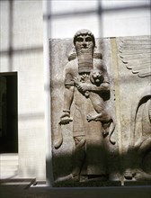 Assyrian sculpture of a man holding a lion, Khorsabad, c8th century BC. Artist: Unknown