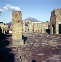 Road leading to Arch of Caligula with Vesuvius beyond, Pompeii, Italy. Creator: Unknown.
