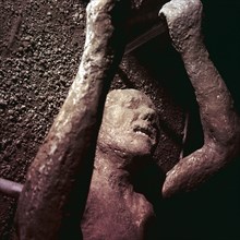 Plaster Cast of a victim of the eruption of Vesuvius at Pompeii, Italy. Creator: Unknown.