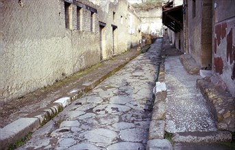 Paved street in the Roman town of Herculaneum, Italy. Artist: Unknown